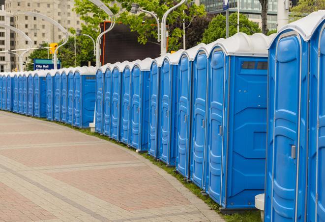 hygienic portable restrooms lined up at a music festival, providing comfort and convenience for attendees in Marion, OH